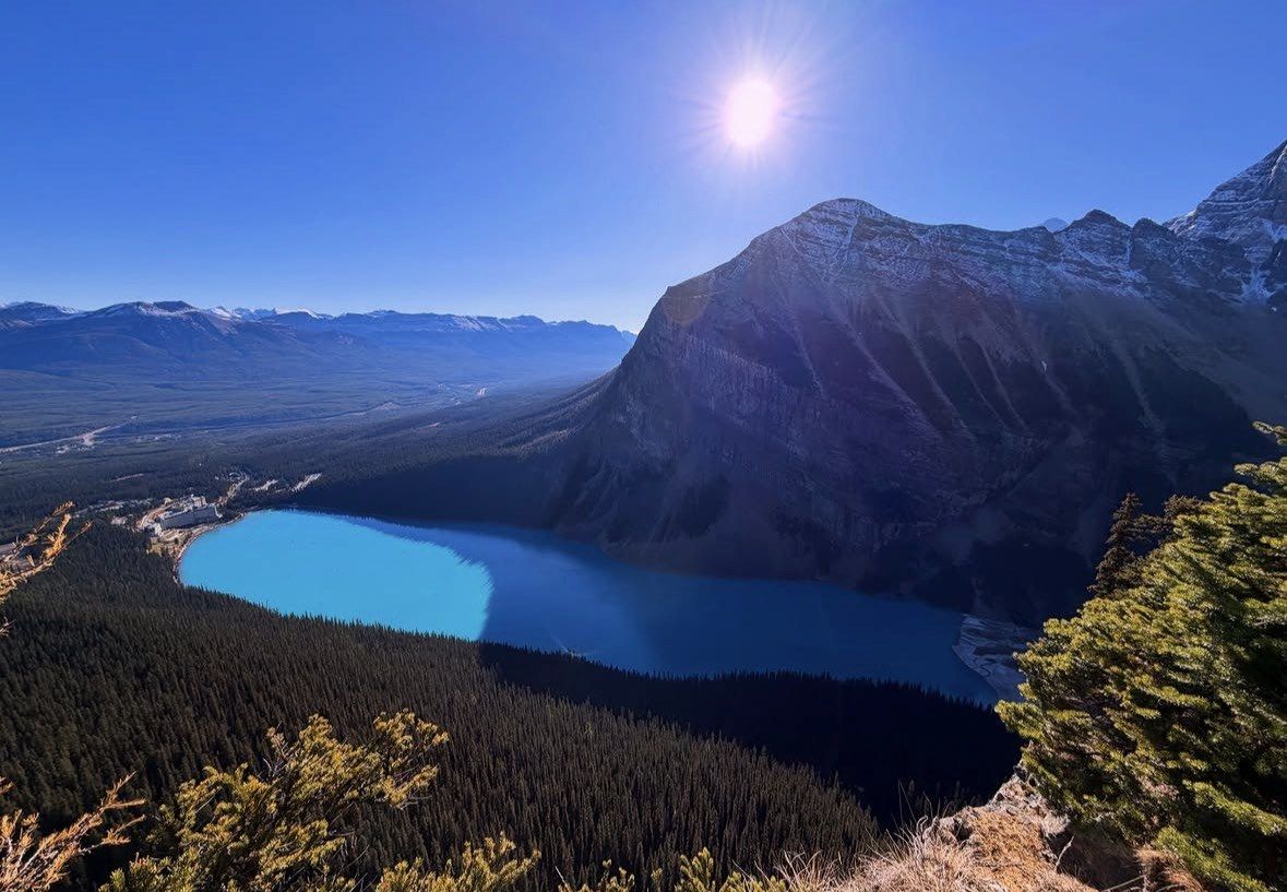 Sun above the ridge with Lake Louise and Bow Valley far below
